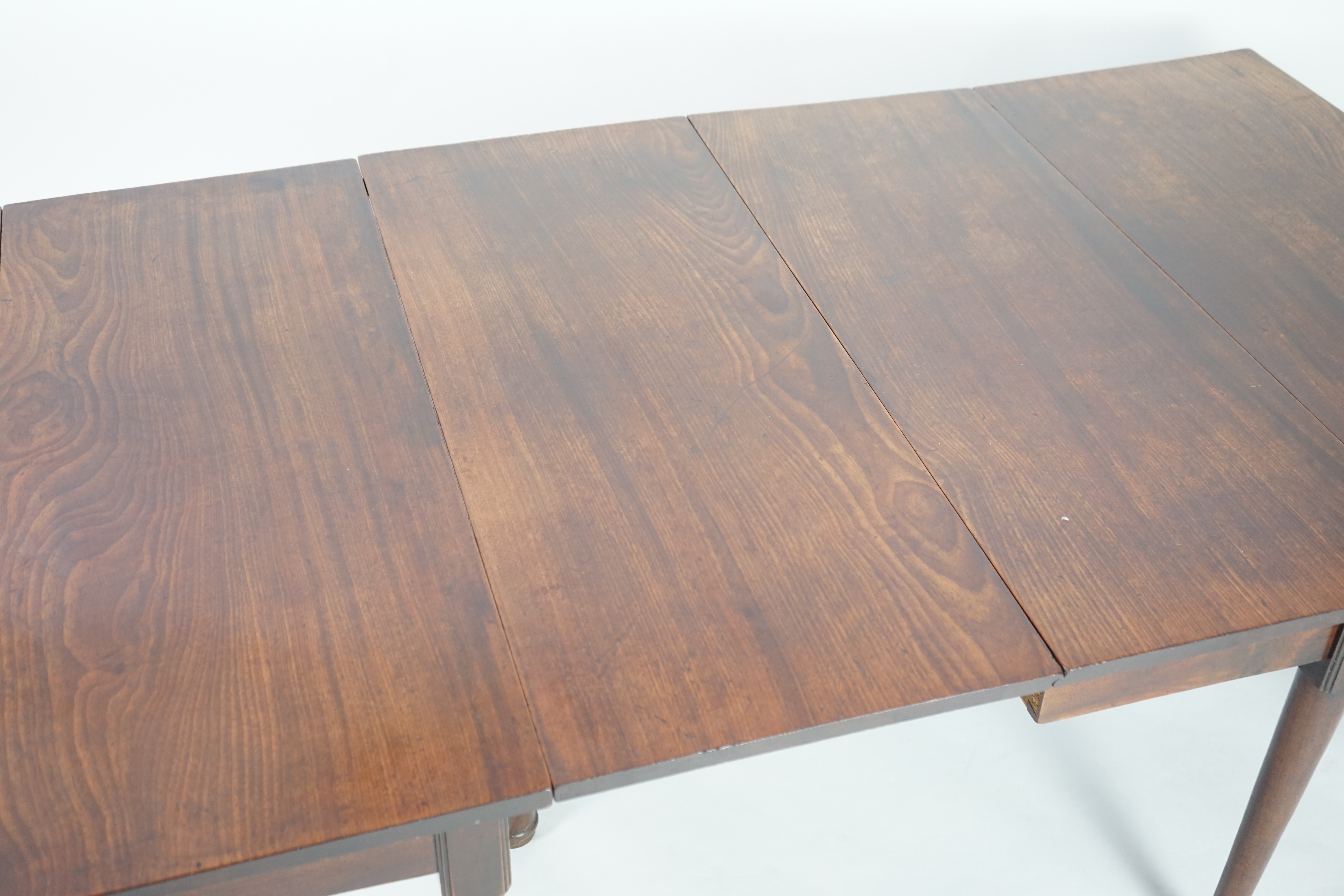 A George II mahogany double drop leaf dining table